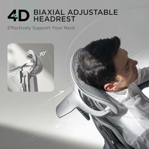 Man using chair with 4D biaxial adjustable headrest.