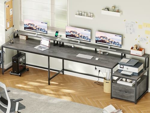 Modern home office with multiple monitors and printer.