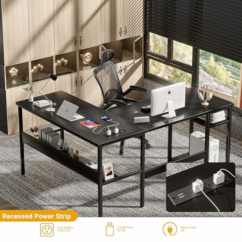 Modern office desk with computer, chair, and recessed power strip.