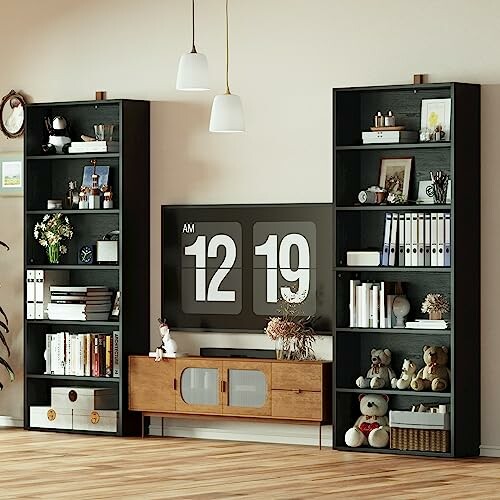 Modern living room with bookshelves, large clock, and decor items.