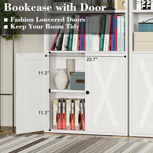 White bookcase with louvered doors and books on shelves.